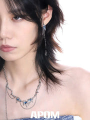 ต่างหูแบบติดพู่ไม่สมมาตรเคลือบแพลตตินัม 18K S925 จาก Ice Field™