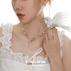 Winged Grace แหวนเปิดปรับได้ 925 เงินสเตอร์ลิง ประดับไข่มุกธรรมชาติรูปนกนางแอ่น รุ่น Winged Grace™