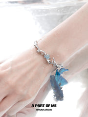 สร้อยข้อมือรูปปลาโลมาเคลือบแพลตตินัม 18K Aqua Fragments™