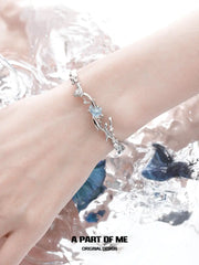 สร้อยข้อมือรูปปลาโลมาเคลือบแพลตตินัม 18K Aqua Fragments™