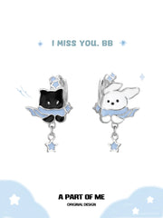 Hello Winter Platinum-Plated Black Kitten and White Puppy Drop Hoop Earrings™